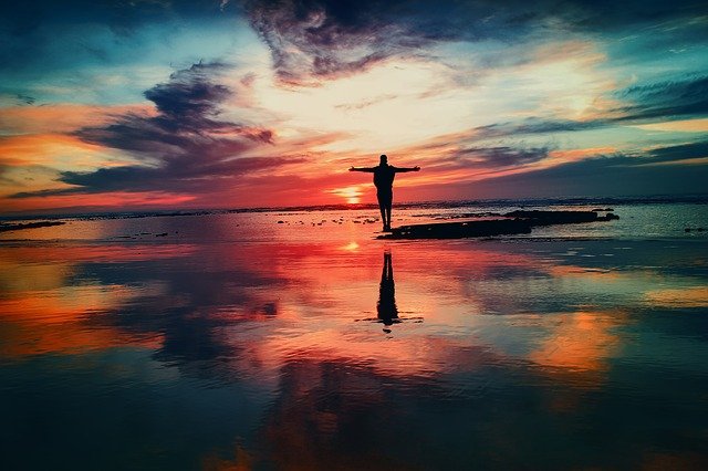 silhouette in front of beautiful sunset