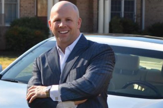 picture of darin kidd in front of lexus