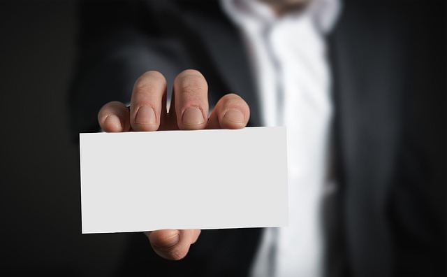 picture of person holding blank business card