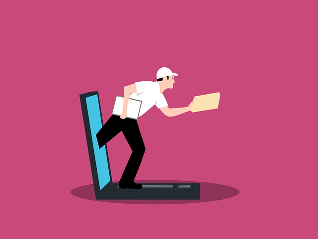 cartoon of man popping out of computer with a gift