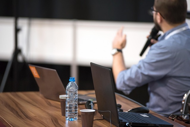 picture of man presenting at a conference