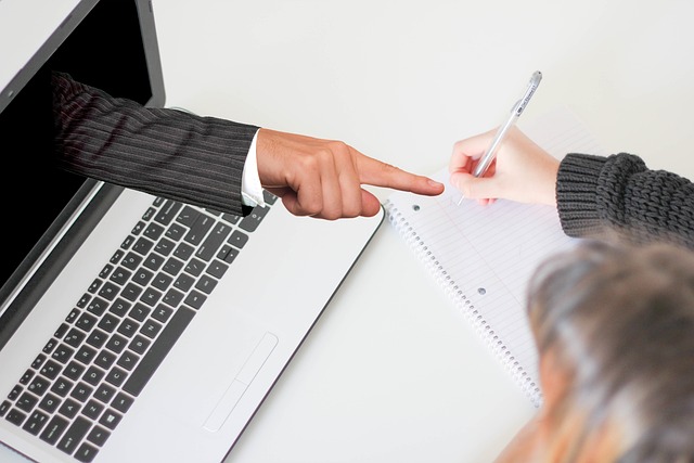 picture of man's arm coming out of laptop screen